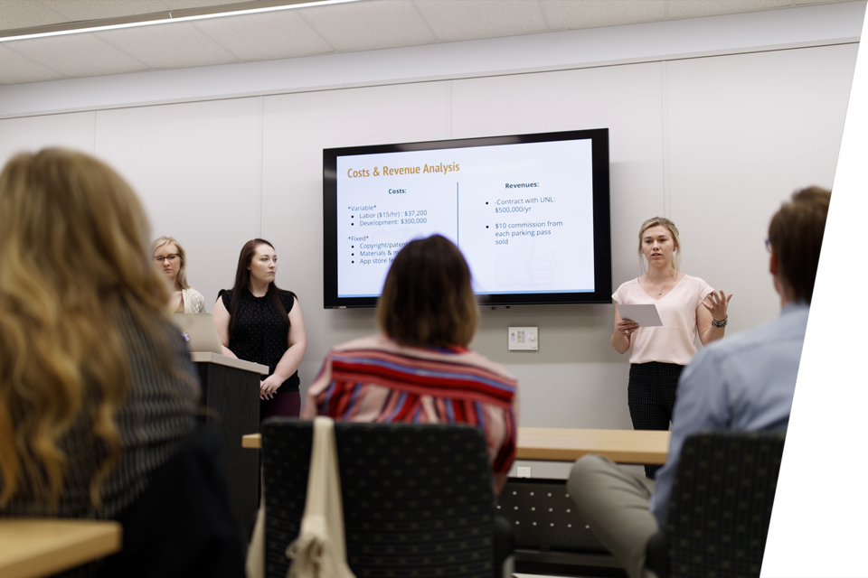 University students present at a seminar.